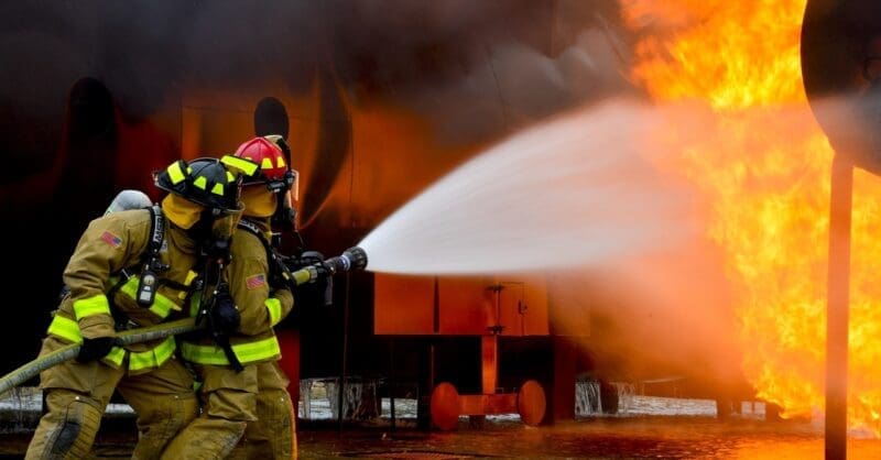 firefighters putting out a burning building
